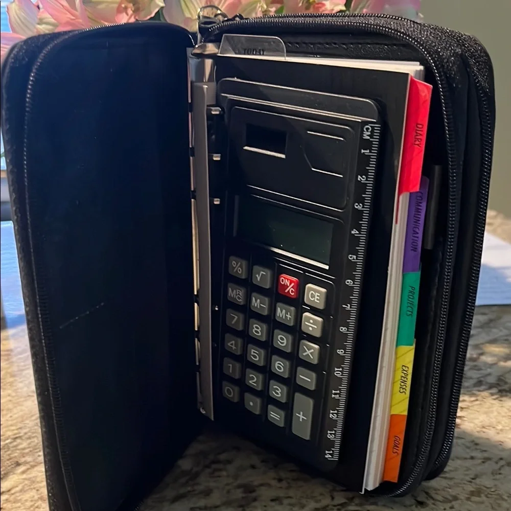 Organizer/Planner/Wallet zippered with Calculator and compartments never used